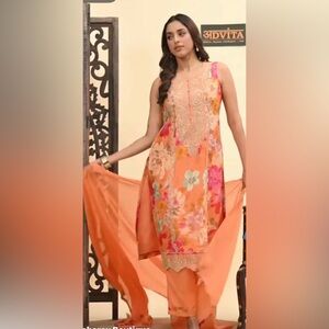 Floral Orange Sleeveless kurta set.